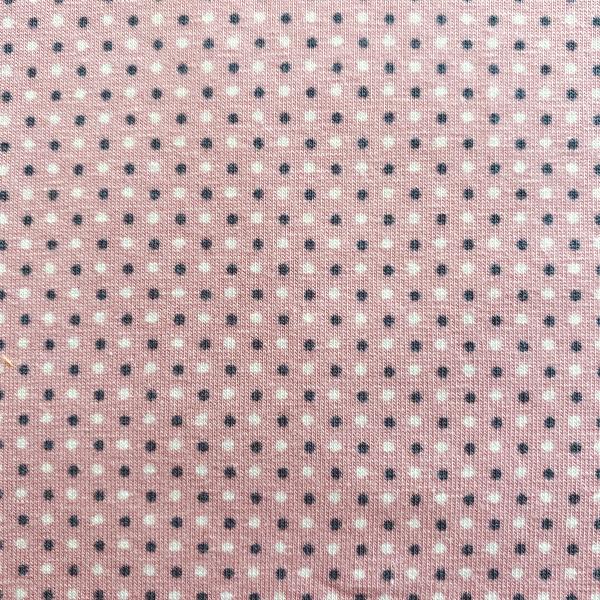 Grey and white dots on pink jersey fabric