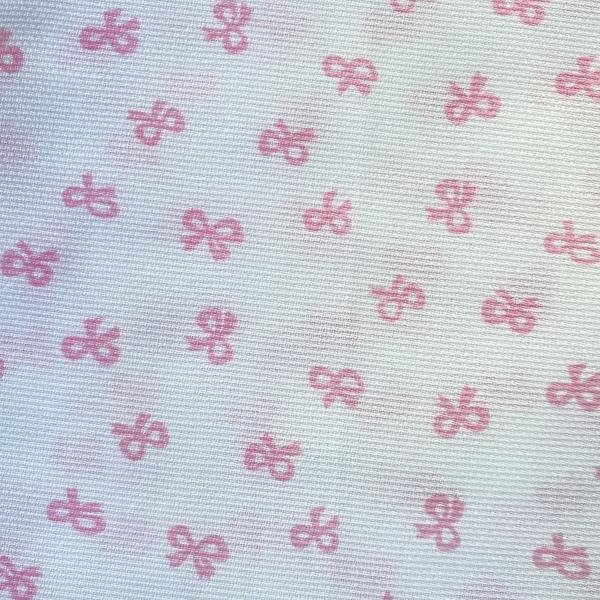 Pink knots on white cotton pique