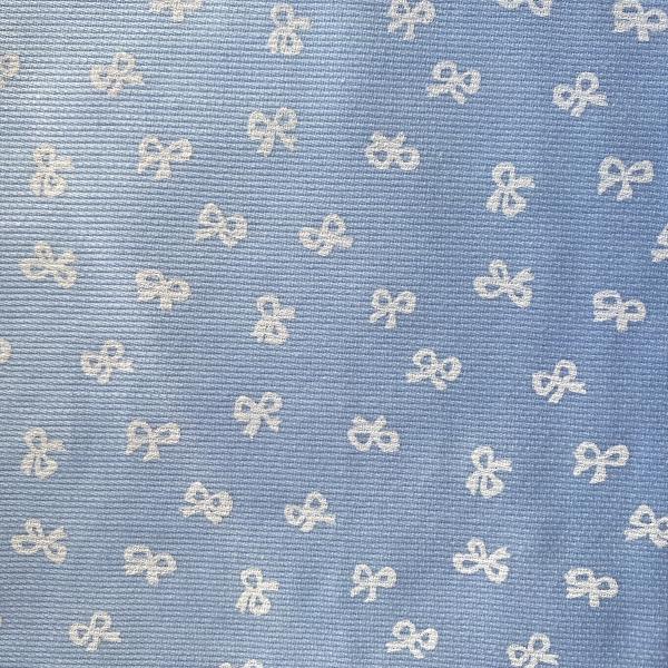White knots on blue cotton pique